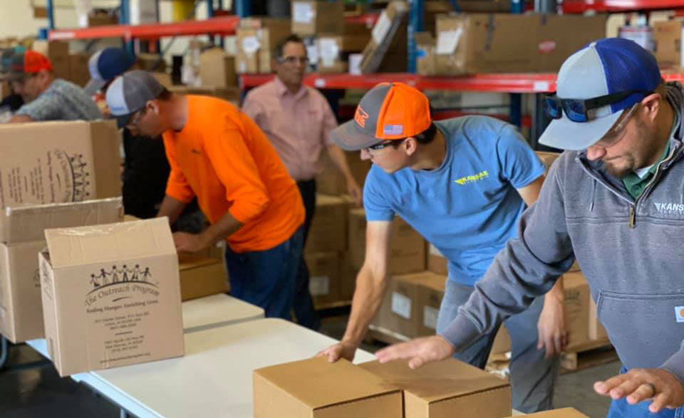 Kansas Electric employees packing meals