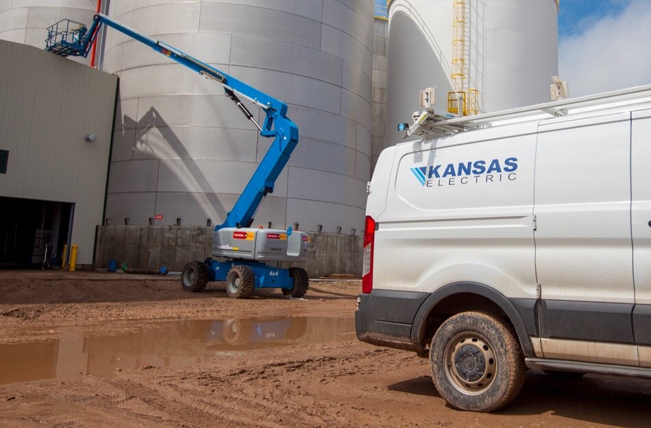 Kansas Electric service vehicles at a job site