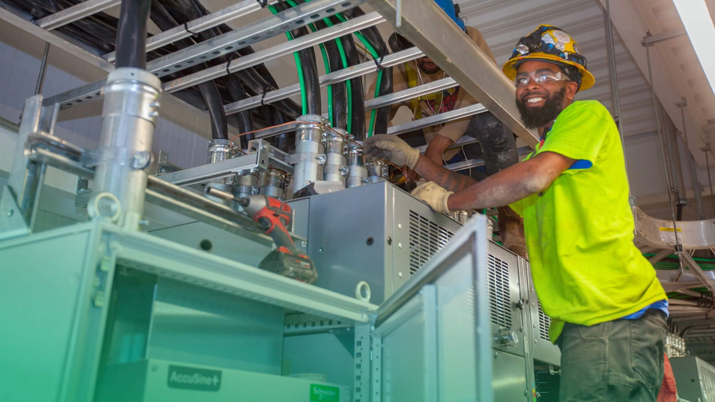 Kansas Electric employees inspecting a connection